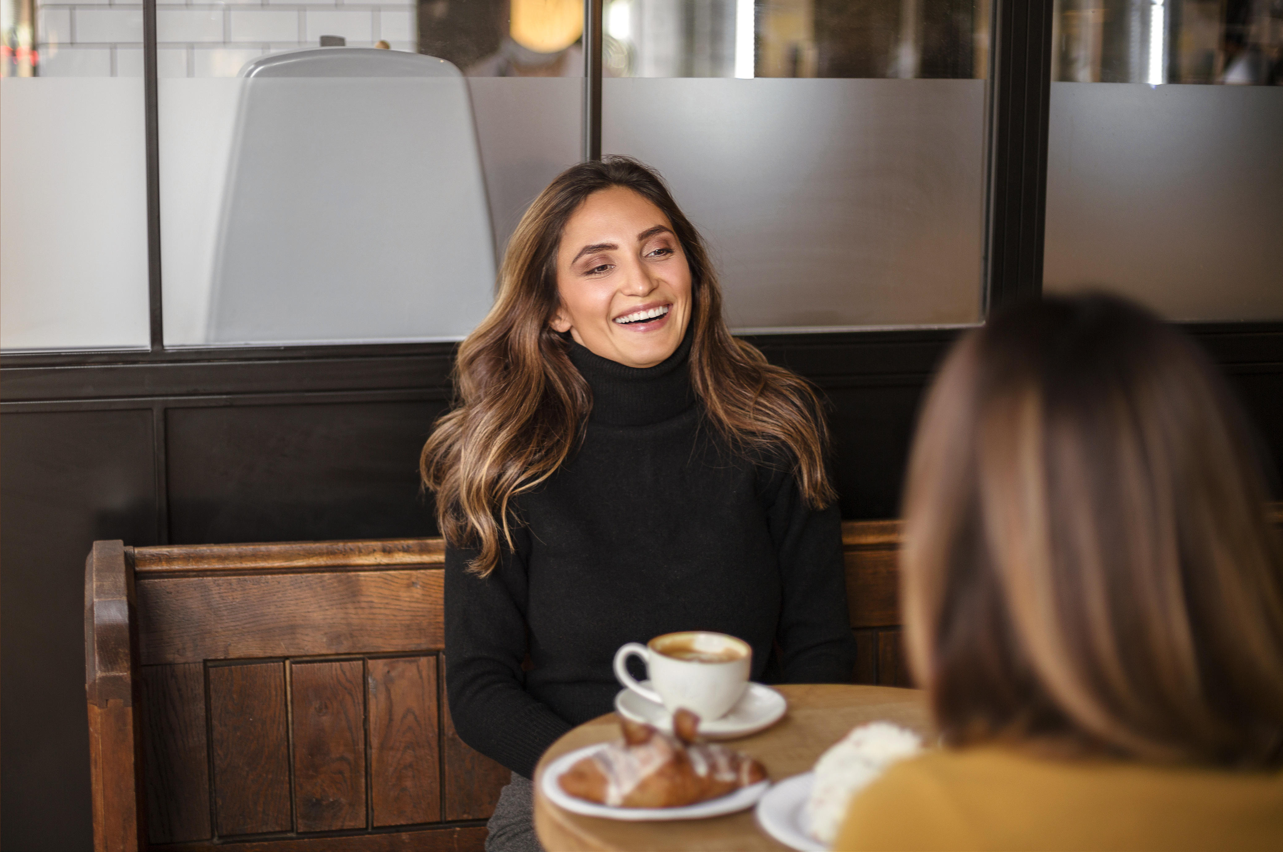 Discussing loan options over coffee